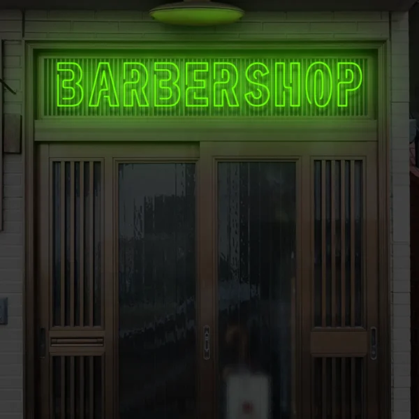 Zielony neonowy napis BARBERSHOP wyrazisty szyld