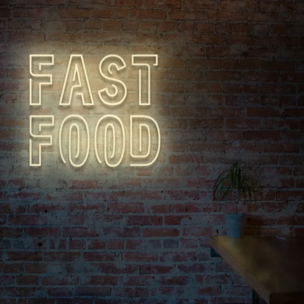 Beżowy neon LED z napisem Fast Food na ceglanej ścianie