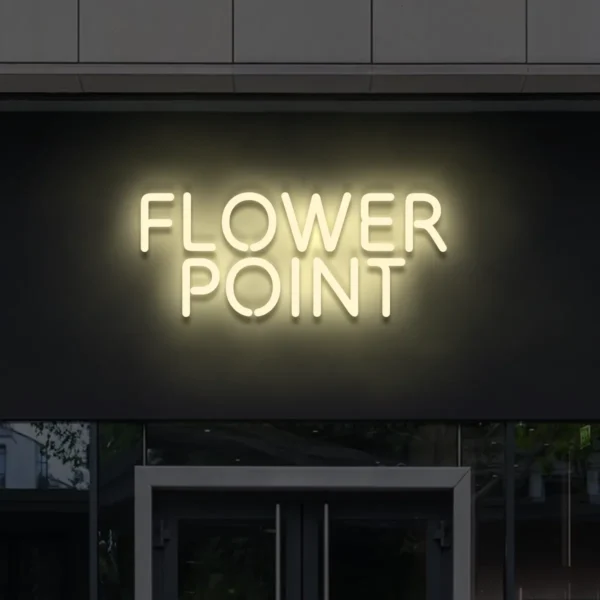 Beżowy napis LED Flower Point na elewacji – nowoczesny neon reklamowy