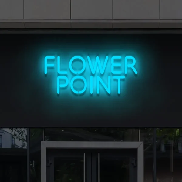 Niebieski napis LED Flower Point – stylowy neon reklamowy na elewacji